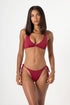 Model wearing the Havana supportive halter bikini top in shiraz dark red with plunge neckline and gold hoop detail front view