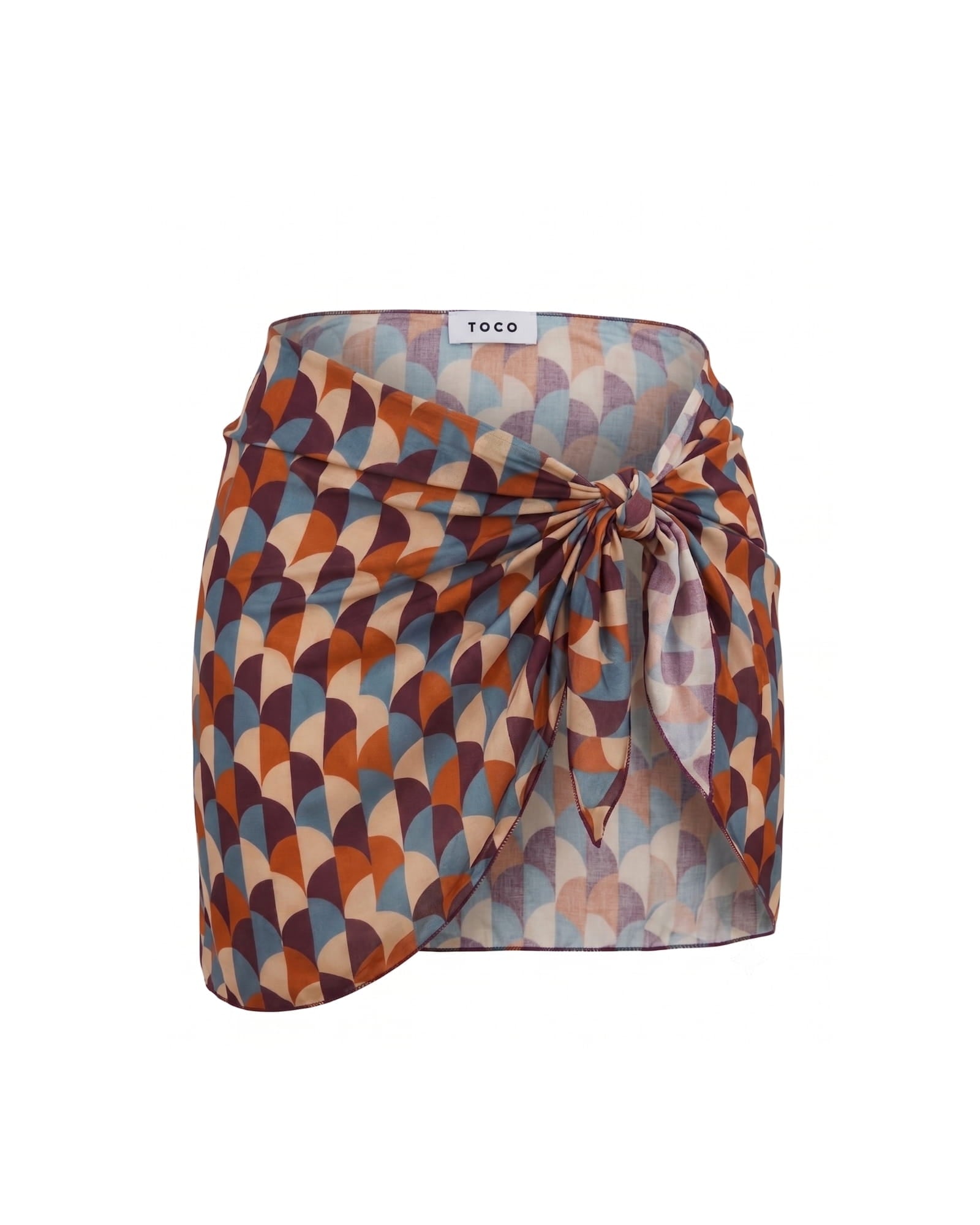 Toco Swim Siren mini sarong in a retro terracotta, blue and plum scallop print, tied at the waist